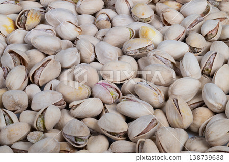 Minimalist pistachios background with even shell coverage, neutral palette and consistent pattern ideal for packaging mockups, social media banners and product labels 138739688