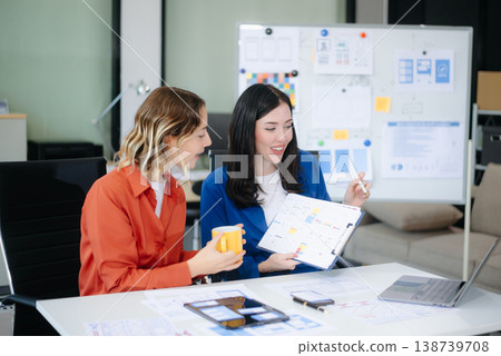 Woman people meeting team brainstorming on their project with laptop, smartphone and digital tablet. Woman people meeting team brainstorming on their project with laptop, smartphone and digital tablet. 138739708
