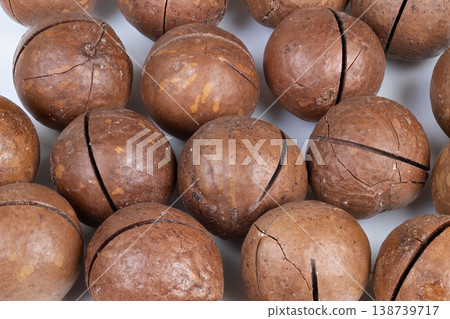 Macadamia nuts protein boost. Clean design featuring macadamia nuts as nutritious snack. Closeup image showcasing healthy macadamia nuts on plain white background for labeling Macadamia nuts protein boost. Clean design featuring macadamia nuts as nutritious snack. Closeup image showcasing healthy macadamia nuts on plain white background for labeling 138739717
