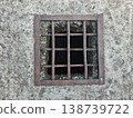 Rusty Metal Grate Over Dark Drain Hole In Weathered Concrete Surface, Closeup Texture Image 138739722