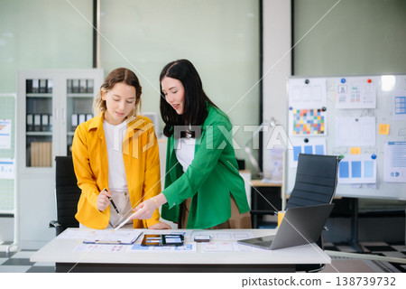 Woman people meeting team brainstorming on their project with laptop, smartphone and digital tablet. Woman people meeting team brainstorming on their project with laptop, smartphone and digital tablet. 138739732
