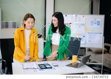 Woman people meeting team brainstorming on their project with laptop, smartphone and digital tablet. Woman people meeting team brainstorming on their project with laptop, smartphone and digital tablet. 138739733