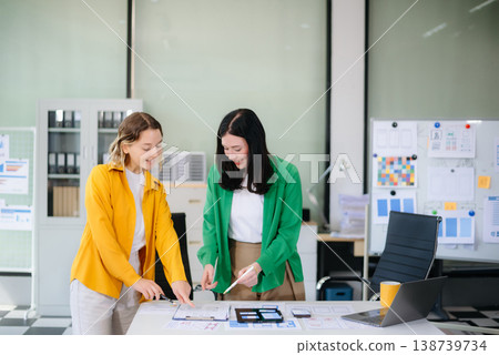 Woman people meeting team brainstorming on their project with laptop, smartphone and digital tablet. Woman people meeting team brainstorming on their project with laptop, smartphone and digital tablet. 138739734