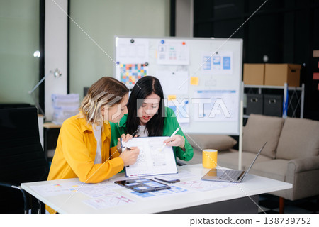 Woman people meeting team brainstorming on their project with laptop, smartphone and digital tablet. 138739752