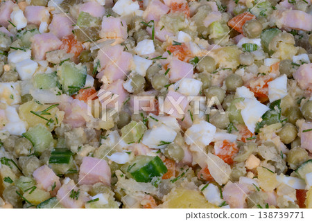 Prepared ham salad. Olivier salad with ham prepared for travel and office use. Home cook meticulously packs chilled ham salad servings for convenient office lunches Prepared ham salad. Olivier salad with ham prepared for travel and office use. Home cook meticulously packs chilled ham salad servings for convenient office lunches 138739771