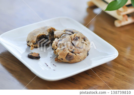 cookie, cooky or chocolate chip cookie or chocolate cookie or soft cookie 138739810