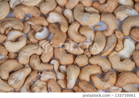 Cashews as vegan dessert base and cream ingredient, buttery texture and pale interiors suggest blending into smooth dairyfree fillings, ideal for plantbased recipe visuals Cashews as vegan dessert base and cream ingredient, buttery texture and pale interiors suggest blending into smooth dairyfree fillings, ideal for plantbased recipe visuals 138739861