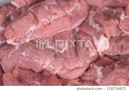 Raw pork ready. Uncooked pork meat prepared specifically for culinary applications. Freshly prepared uncooked pork meat suitable for multiple cooking methods and recipes Raw pork ready. Uncooked pork meat prepared specifically for culinary applications. Freshly prepared uncooked pork meat suitable for multiple cooking methods and recipes 138739872
