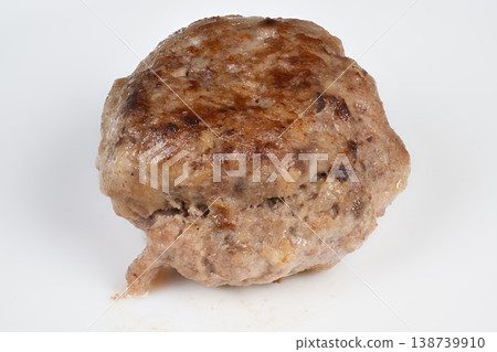 Cooked cutlet on white background. Image of seared cutlet with crust and moisture. Visual presentation capturing texture and moisture of panseared cutlet during cooking Cooked cutlet on white background. Image of seared cutlet with crust and moisture. Visual presentation capturing texture and moisture of panseared cutlet during cooking 138739910