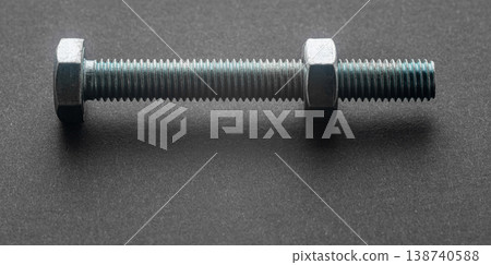 construction bolt close-up on a black background 138740588