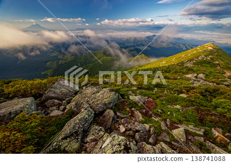 Clouds gather over the ridge of Mt. Kinpu in Okuchichibu and Mt. Fuji. 138741088