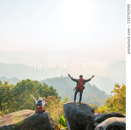 Sunrise bathes mountain peaks in golden light 138742098