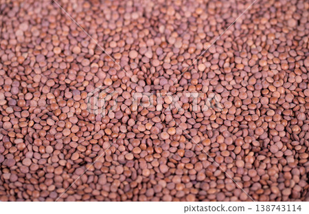 Legume pattern design. Uniform pattern capturing tiny legumes for packaging use. Textured macro view showcasing small lentils for commercial and packaging applications Legume pattern design. Uniform pattern capturing tiny legumes for packaging use. Textured macro view showcasing small lentils for commercial and packaging applications 138743114