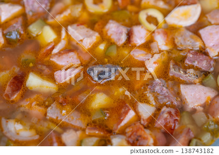 Savory meat stew. Zesty potato sausage soup. Comforting homemade broth with sausage and potatoes. Hearty sausage and potato broth served warm and homemade style Savory meat stew. Zesty potato sausage soup. Comforting homemade broth with sausage and potatoes. Hearty sausage and potato broth served warm and homemade style 138743182
