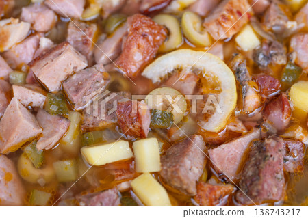 Family recipe hearty potato soup. Homemade sausage and potato broth bubbling gently. Nostalgic family recipe with tender potatoes sausage and rich amber broth simmering Family recipe hearty potato soup. Homemade sausage and potato broth bubbling gently. Nostalgic family recipe with tender potatoes sausage and rich amber broth simmering 138743217