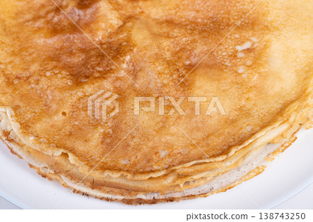 Crispy pancake display. Artisan style pancakes arranged on handmade rustic platter. Gourmet pancake assembly showcasing artisanal craftsmanship and textured surface appeal Crispy pancake display. Artisan style pancakes arranged on handmade rustic platter. Gourmet pancake assembly showcasing artisanal craftsmanship and textured surface appeal 138743250