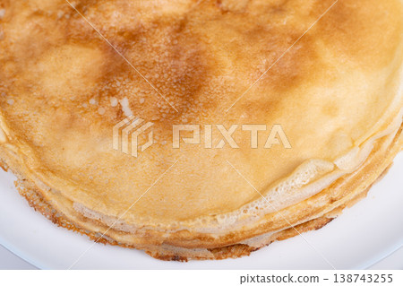 Buttery pancake with crunchy edges. Tasty pancake featuring crispiness and buttery richness. Delectable pancake boasting crunchiness on edges and rich buttery taste throughout Buttery pancake with crunchy edges. Tasty pancake featuring crispiness and buttery richness. Delectable pancake boasting crunchiness on edges and rich buttery taste throughout 138743255