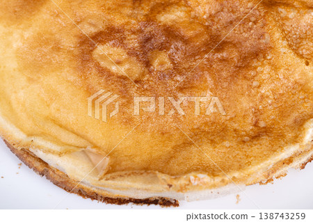 Festive pancake display. Decorative thin pancakes ready to serve at holiday feast. Delicious layered pancakes presented beautifully for Maslenitsa celebration and feast Festive pancake display. Decorative thin pancakes ready to serve at holiday feast. Delicious layered pancakes presented beautifully for Maslenitsa celebration and feast 138743259