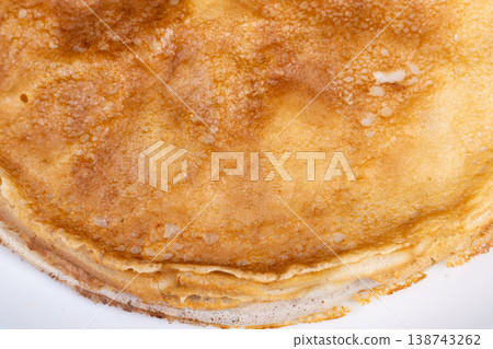 Close pancake view. Layered pancakes with gentle folds. Closeup of stacked fluffy pancakes details. An inviting scene showcasing toasted pancake rings with morning light Close pancake view. Layered pancakes with gentle folds. Closeup of stacked fluffy pancakes details. An inviting scene showcasing toasted pancake rings with morning light 138743262
