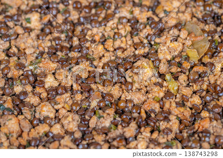 Hearty minced lentils simmered. Rustic lentil and minced meat stew with aromatic spices. Homestyle simmered lentils combined with seasoned ground meat and flavorful herbs Hearty minced lentils simmered. Rustic lentil and minced meat stew with aromatic spices. Homestyle simmered lentils combined with seasoned ground meat and flavorful herbs 138743298
