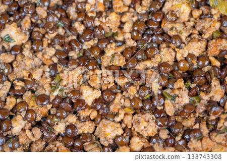 Macro texture shot showing lentils and meat, high detail surface, glossy reflections, granular mince and tiny herb specks, optimized for food blog closeups and editorial visuals 138743308