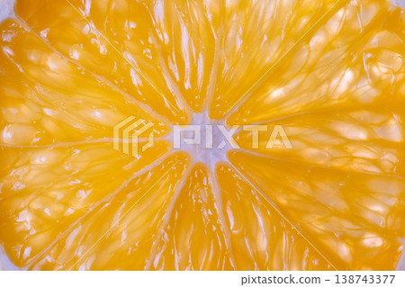 Minimalist ripe orange texture showcased as bold graphic element, symmetrical slice and saturated yellow form modern still life composition for editorial or poster use 138743377