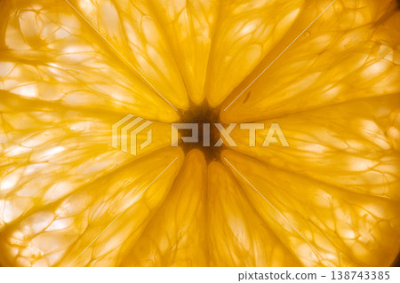 Vivid citrus illumination. Bright orange with detailed textures. Luminous orange piece reveals delicate membranes and fibrous structure beneath warm studio lighting Vivid citrus illumination. Bright orange with detailed textures. Luminous orange piece reveals delicate membranes and fibrous structure beneath warm studio lighting 138743385