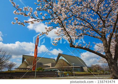A view of the concert hall with cherry blossoms in full bloom. A view of the concert hall with cherry blossoms in full bloom. 138743474