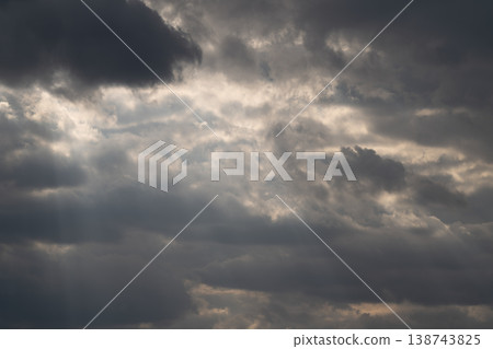 Cinematic clouds with light beams piercing sky, sweeping rays creating crepuscular effect, soft highlights on cloud edges, inspirational mood for film and landscape projects Cinematic clouds with light beams piercing sky, sweeping rays creating crepuscular effect, soft highlights on cloud edges, inspirational mood for film and landscape projects 138743825