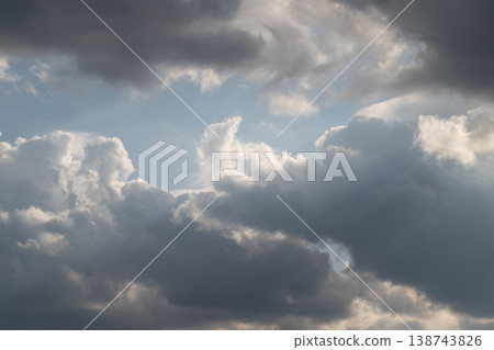 Sky with sunlight. Sunshine piercing through cloudy sky. Cloudfilled sky illuminated by scattered sunbeams. Overcast sky with bright rays breaking through heavy clouds Sky with sunlight. Sunshine piercing through cloudy sky. Cloudfilled sky illuminated by scattered sunbeams. Overcast sky with bright rays breaking through heavy clouds 138743826