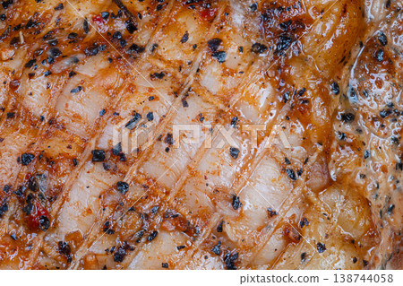 Closeup delistyle ovenbaked pork slices on display counter, vendor arranging charcuterie selection for sandwich service, tender moist meat and textured crust visible Closeup delistyle ovenbaked pork slices on display counter, vendor arranging charcuterie selection for sandwich service, tender moist meat and textured crust visible 138744058