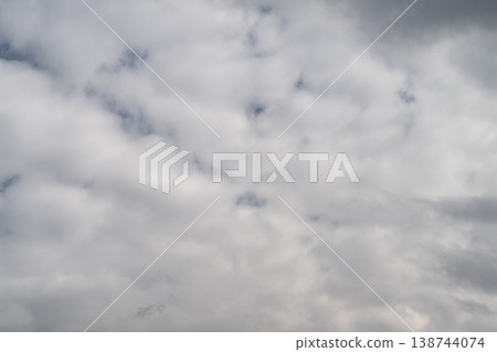 Soft overcast sky with gentle illumination. Delicate overcast sky characterized by muted illumination. Subtle cloudy atmosphere featuring tender texture and faint diffused glow Soft overcast sky with gentle illumination. Delicate overcast sky characterized by muted illumination. Subtle cloudy atmosphere featuring tender texture and faint diffused glow 138744074