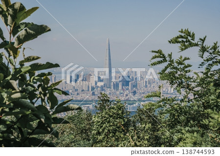 Panoramic view of Seoul city skyline with high-rise buildings and mountains from Daemosan mountain peak. Panoramic view of Seoul city skyline with high-rise buildings and mountains from Daemosan mountain peak. 138744593