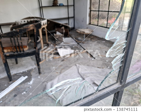 Gritty Minimalist interior of a damaged room with broken glass and debris Gritty Minimalist interior of a damaged room with broken glass and debris 138745111