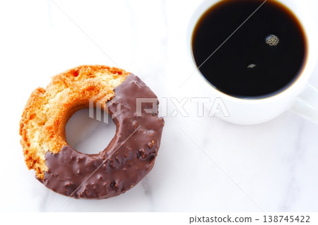 Donuts and Coffee - Chocolate-covered old-fashioned donuts and coffee 138745422
