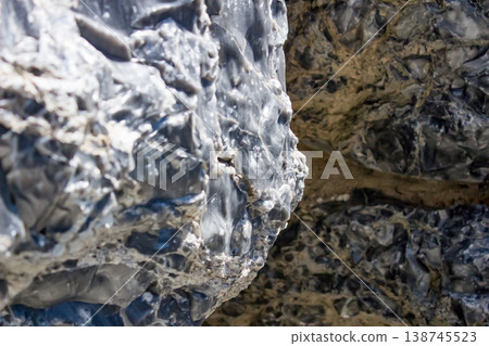 Obsidian cliffs exposed on the surface of Himeshima Island, Oita Prefecture Obsidian cliffs exposed on the surface of Himeshima Island, Oita Prefecture 138745523