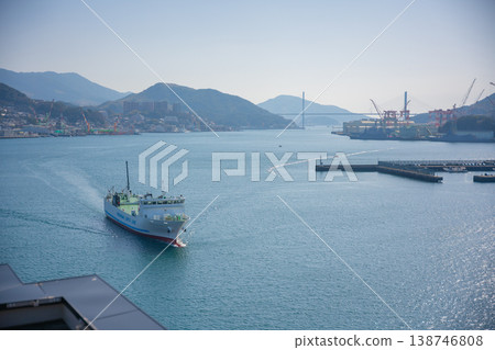 A ferry sailing across the bay and the harbor scenery. 138746808
