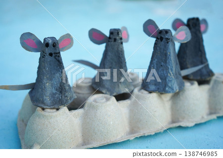 A family of mice, hand-made from a cardboard egg box, close-up. An eco-friendly idea for reuse, decorations for Easter, a gift for dad, mom, on family day. A family of mice, hand-made from a cardboard egg box, close-up. An eco-friendly idea for reuse, decorations for Easter, a gift for dad, mom, on family day. 138746985