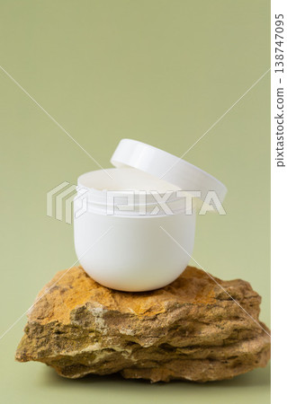 Open cosmetic cream jar with white moisturizing face cream on natural stone background, skincare product texture, minimal beauty concept Open cosmetic cream jar with white moisturizing face cream on natural stone background, skincare product texture, minimal beauty concept 138747095