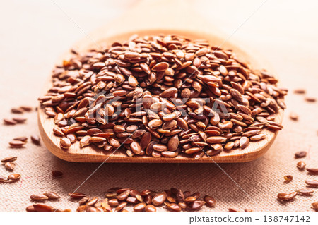 Flax seeds linseed on wooden spoon 138747142