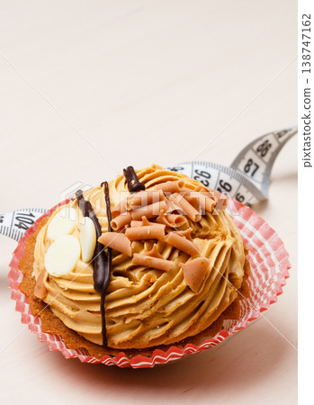 cupcake with measuring tapes on table cupcake with measuring tapes on table 138747162