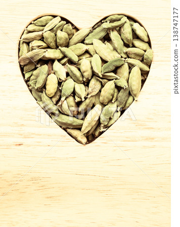 Green cardamom pods heart form Green cardamom pods heart form 138747177