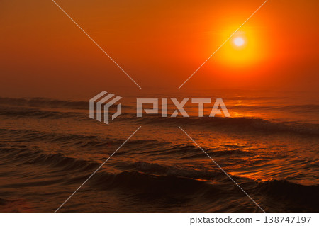 Beatiful red sunset over sea surface Beatiful red sunset over sea surface 138747197
