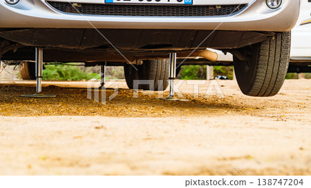 Caravan leveling support leg in use. Caravan leveling support leg in use. 138747204
