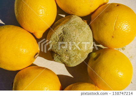 Healthy and rotten lemon fruits 138747214
