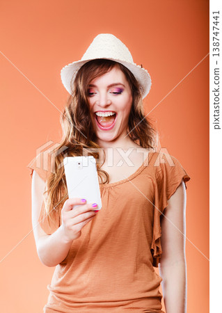 Woman taking self picture with smartphone camera Woman taking self picture with smartphone camera 138747441