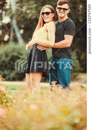 Couple hugging in park. 138747504