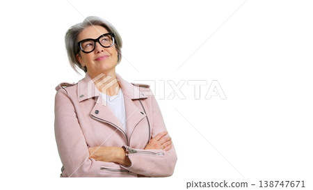 Mature woman wearing glasses looking up smiling cheerfully Mature woman wearing glasses looking up smiling cheerfully 138747671