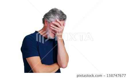 Senior man feeling stressed covering face with hand Senior man feeling stressed covering face with hand 138747677