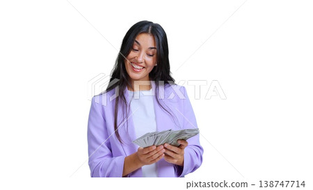 Happy woman holding money banknotes celebrating financial success Happy woman holding money banknotes celebrating financial success 138747714
